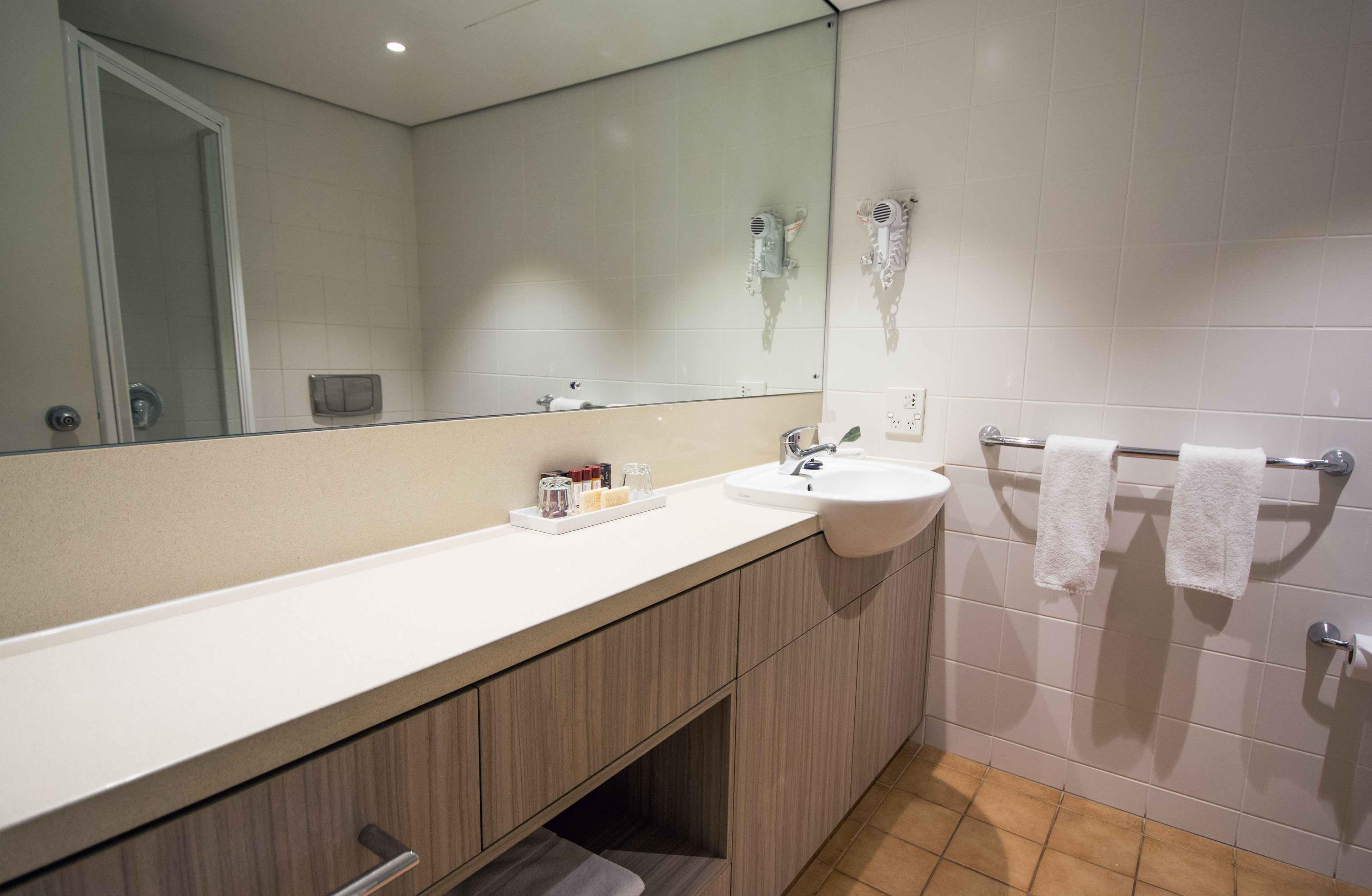 hotel bathroom with long countertop