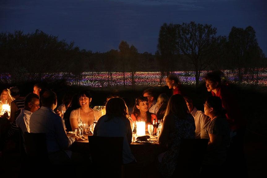 Dinner by candlelight in front of Field of Light at Ayers Rock